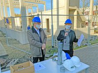 The foundation stone for the new development center is laid.